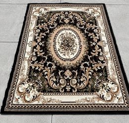 Brown area rug/carpet