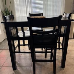 Black Barstool Table With Four Chairs