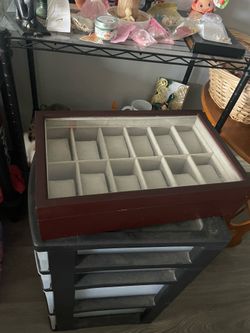 12-slot mahogany wooden watch organizer featuring a clear glass lid.