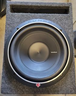 Rockford Fosgate 10-inch subwoofer with box and amplifier.