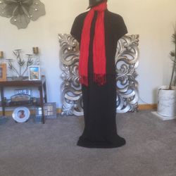 Black dress short sleeves nice size 16 with a red scarf. Hat Not Included.