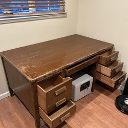 Large wooden office desk with drawers