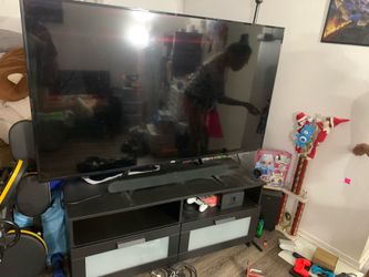 Used ONN 4K UHD Smart TV. With soundbar and table stand