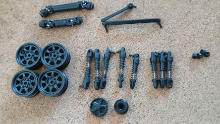 Axial scx30 spare parts New 22&25mm shocks ,center drive line k10 ,steering links,rims,lugnut