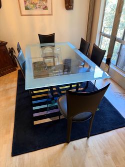Glass dining room table with 6 premium leather chairs