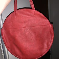 red purse with print interior 