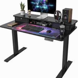 Used, Like New: FEZIBO 40 x 24 Inch Height Adjustable Electric Standing Desk with Double Drawer, Stand Up Desk with Storage Shelf, Sit Stand Desk, Bla