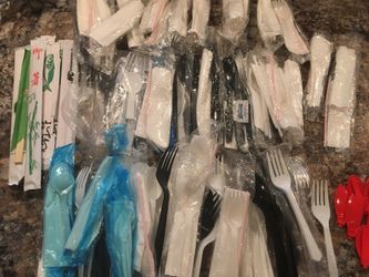Hundreds of plastic folks, spoons, knives, etc