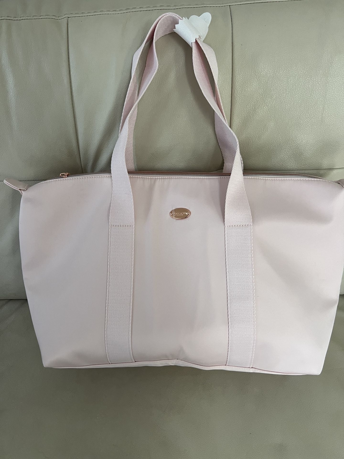 COACH Receive a Free Tote Bag with any large spray purchase from the Coach Women's Fragrance Collection