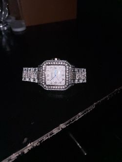 Iced out Cartier watch
