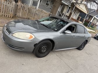 Gray Chevy impala