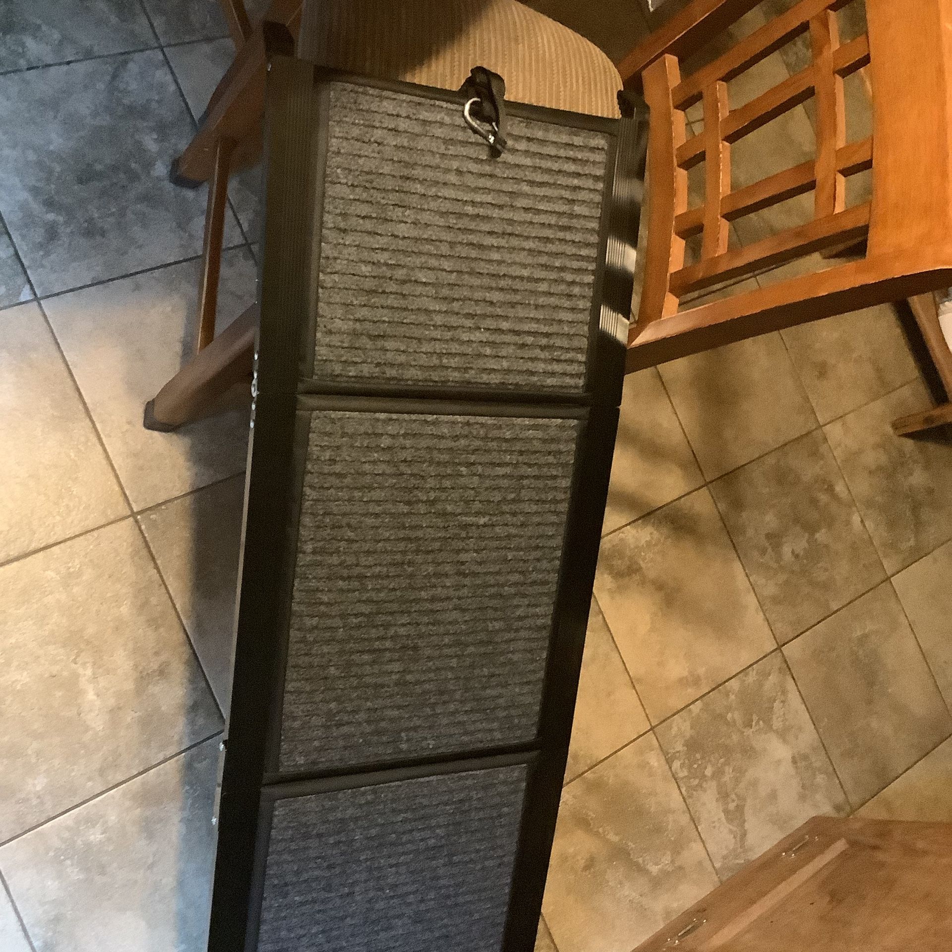 Pet vehicle ramp brand new in box easy attach to any vehicle for safe and easy entry easy fold and go Approximately 62” long and 17.5” wide Brand new