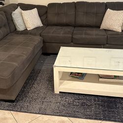 Grey Sectional With Area Rug