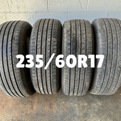Four 235/60R17 Tires