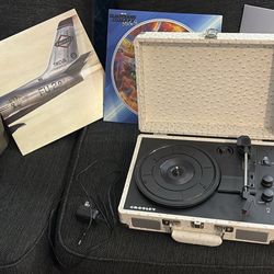 vinyl player with 3 records