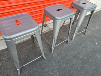 Three Grey Metal Barstools