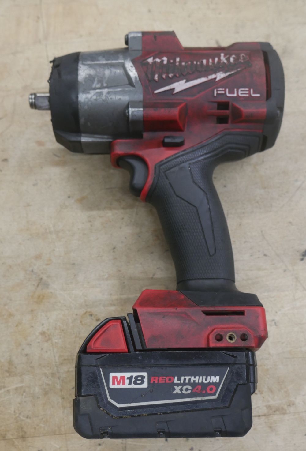 Milwaukee 2967-20 M18 FUEL 18V 1/2 in High Torque Impact Wrench   4.0 AH Battery.  USED. TESTED. IN A GOOD WORKING ORDER.
