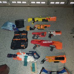 Multiple Nerf Guns, Including Various Accessories And Extra Darts