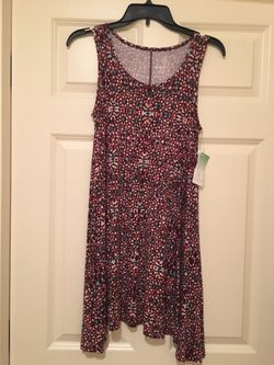 Brand new juniors size small sleeveless swing dress. Still has tags. Burgundy print. Jersey material.