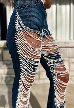 Women's distressed denim jeans with rhinestones and a sexy chain—perfect for nightclubs and parties.