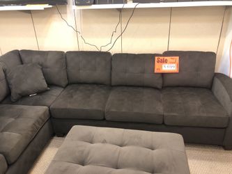 Brown sectional sofa with ottoman