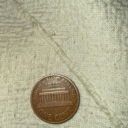 1959-D Penny, unique features such as an "L" touching the rim. 