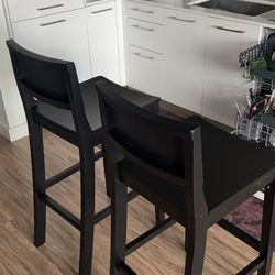 2 black barstools