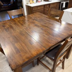 Walnut dining table with four chairs