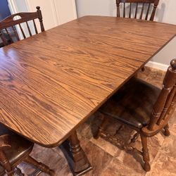 Table With 3 Extensions And 5 Chairs. 