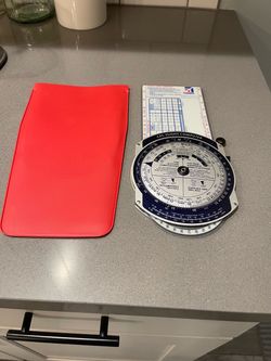 Vintage ( Aviation ) Cessna Flight Computer Slide rule from 1982 in Excellent condition with protective Red Plastic sleeve