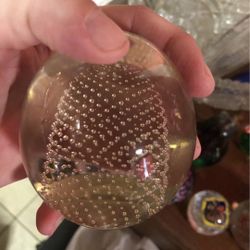 Vintage clear glass paperweight with controlled bubble piece inside
