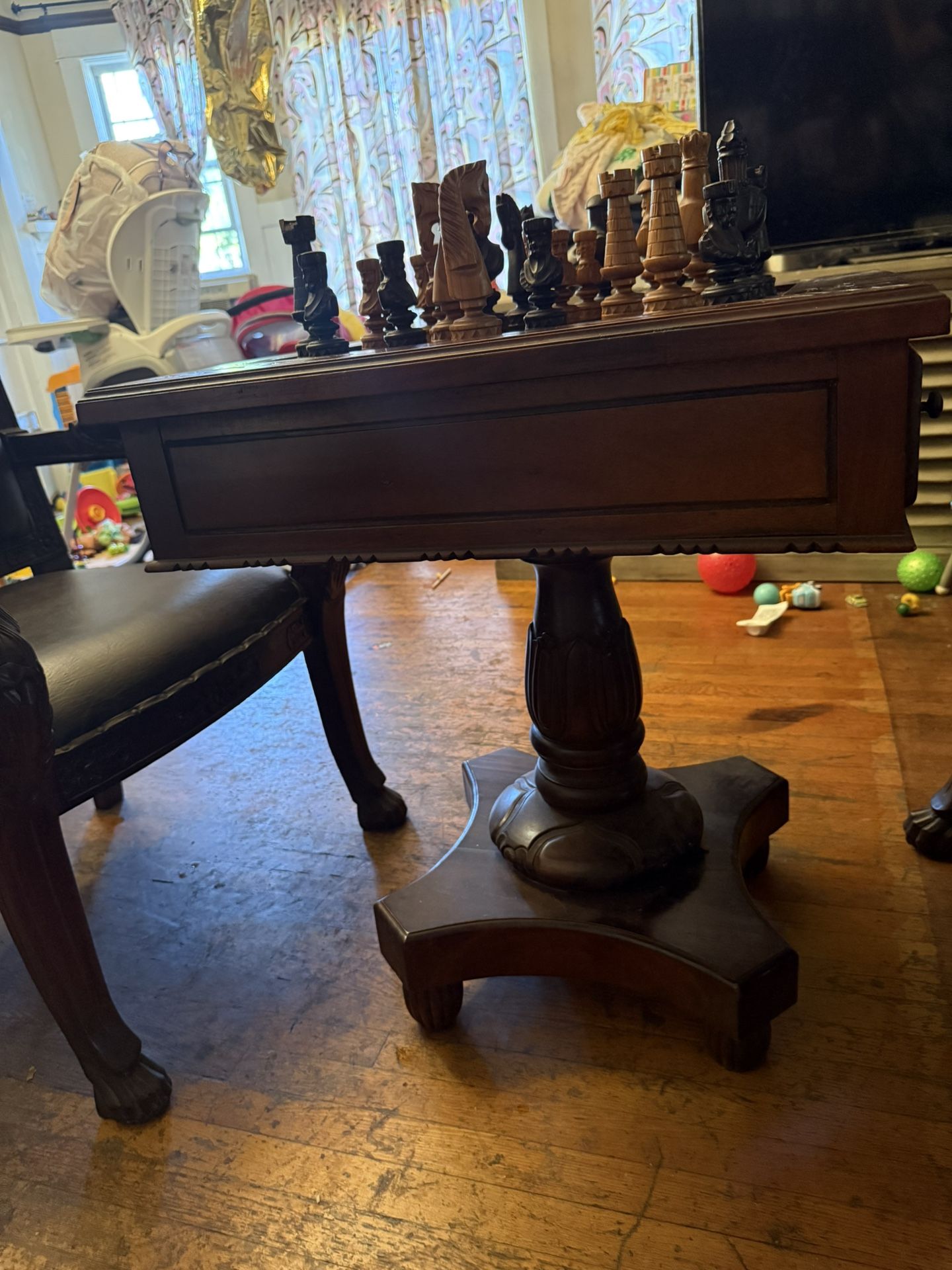 Chess Table With Chairs And Game Pieces