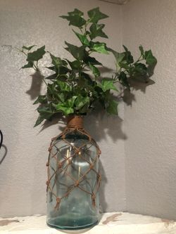 Glass vase with artificial plant