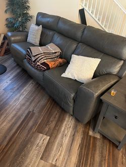 Soft  leather green reclining love seat