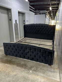 Black velvet tufted upholstered king bed