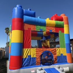 Lego themed bounce house w/ basket ball hoop