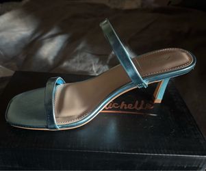 Female blue shiny low heels