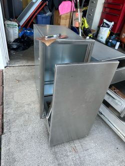 Outdoor kitchen, trash can holder