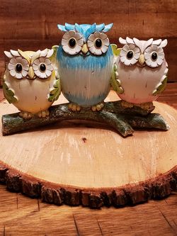 Craved owls on a branch decoration