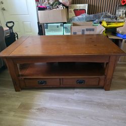 "Lift-top coffee table with 2 end tables."