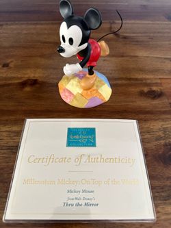 Millennium Mickey on top of the world figurine