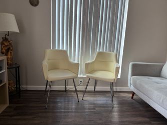 2 gorgeous cream colored sitting chairs