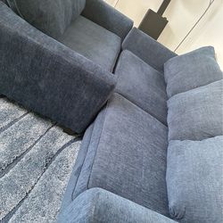 Blue couches for sell with blue matching rug