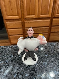 Ceramic Groom and Bride pair of Salt and Pepper Shakers.  Size approximately  6 inches tall.  Brand new never used.  Brand Clay Art.  Has been on disp