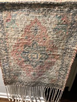 A beautiful (50” x 28”) wall hanging foreign rug