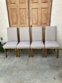 Free Set of 4 Upholstered Dining Chairs with Nailhead Trim
