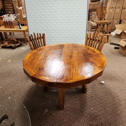 Beautiful hand made teak table and chairs. Indoor or outdoor 51 inch diameter.