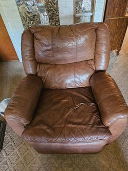 Medium chestnut brown leather rocking recliner.