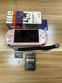 Pink PSP 3000 with over 100 games installed.                V18