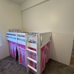 Loft twin size bed with princess cover.
